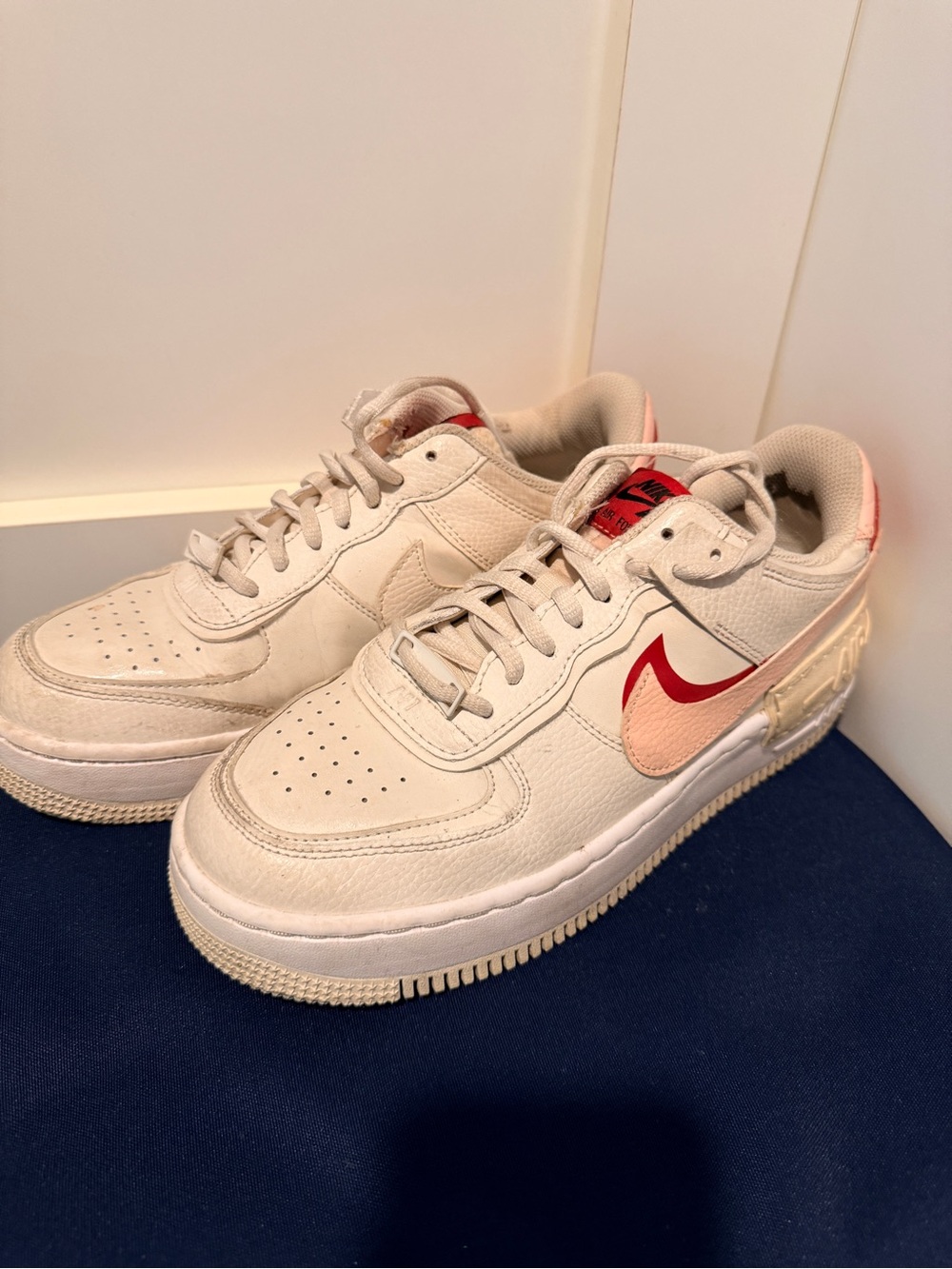 Nike Cream Low-Top Sneakers with Red and Pink Swoosh
